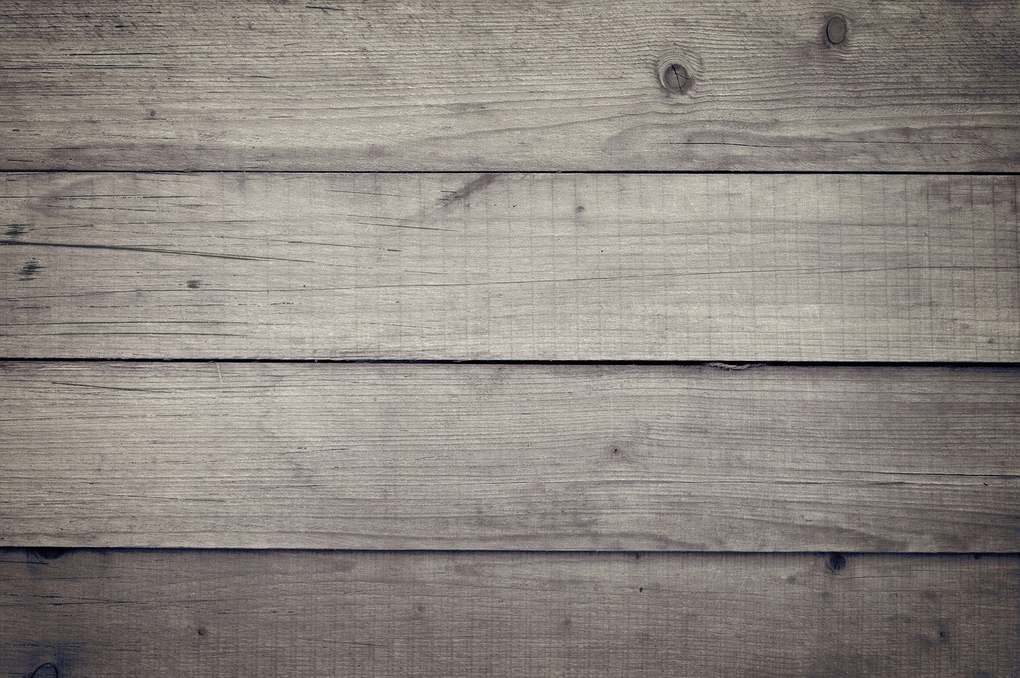 Planches de bois usagées alignées horizontalement, texture marquée par les fibres et les nœuds Planches de bois usagées alignées horizontalement, texture marquée par les fibres et les nœuds